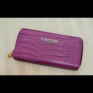 Mauve/berry colored BeBe Los Angeles wallet